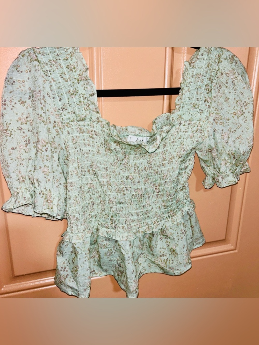 E & M green floral blouse with a square neckline and smocked bodice size S